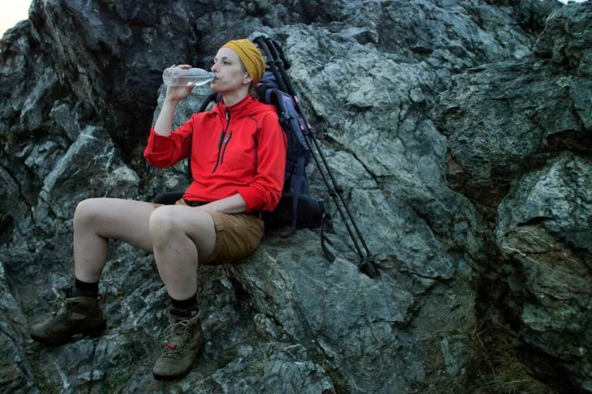 Hiker drinking from water bottle
